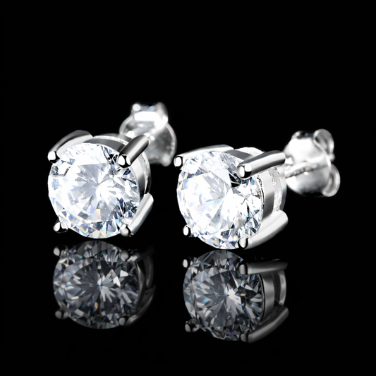 Pair of round-cut diamond stud earrings on a black background with subtle reflection