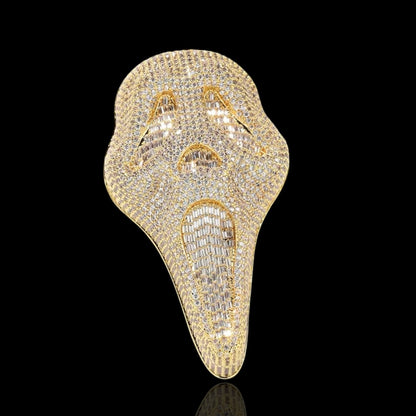 Yellow gold diamond Scream pendant on a black background