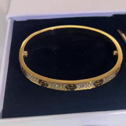 iced out gold bangle bracelet with diamond setting
